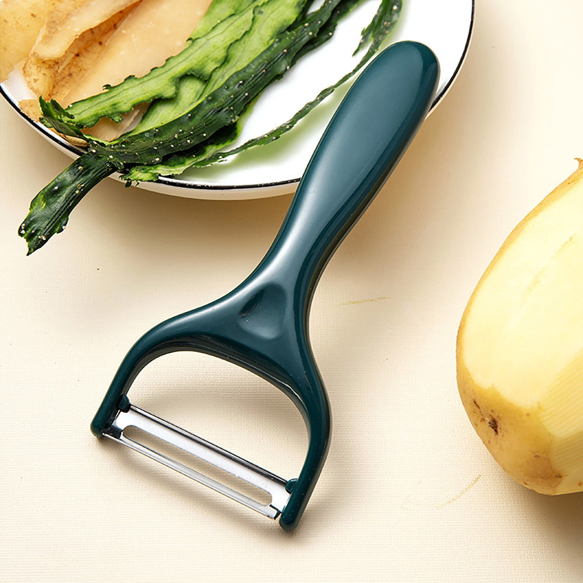 Y-Shaped Vegetable Peeler in Stainless Steel with Green Grip - Image 3
